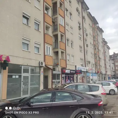 a black car parked in front of a building at Industry in Banja Luka