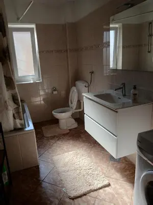 a bathroom with a toilet and a sink at Apartman ZM in Livno