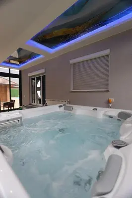 a large tub in a room with at Villa Mali Vuk in Banja Luka