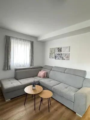 a living room with a couch and a table at Winter Nights Vlasic in Vlasic