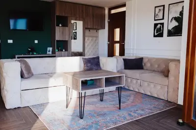a living room with a couch and a coffee table at Pine apartment Vlašić in Vlasic