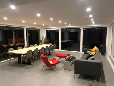 a living room with a table and chairs and a couch at Relax House in Banja Luka