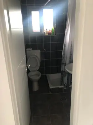 a bathroom with a toilet and a sink at Relax House in Banja Luka