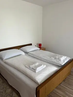two beds sitting next to each other in a room at Motel i Restoran Ana in Donji Svilaj