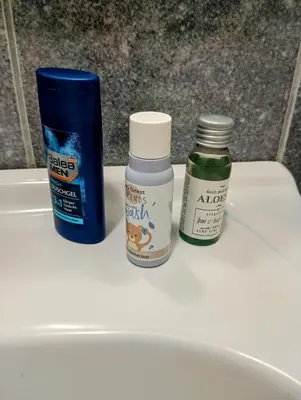 two bottles of medicines sitting on top of a sink at Dnevna Soba in Doboj