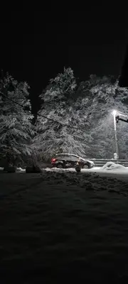 a car parked on the side of a street at night at Vikendica sa djakuzijem Borik in Grabova Kosa