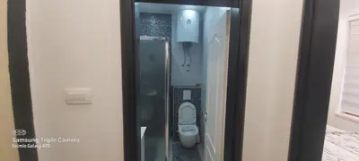 a small bathroom with a toilet in a stall at STUDIO APARTMAN SOl in Tuzla