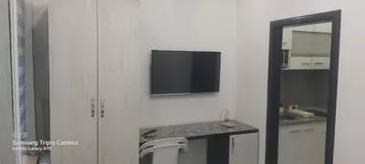 a bathroom with a sink and a tv on the wall at STUDIO APARTMAN SOl in Tuzla