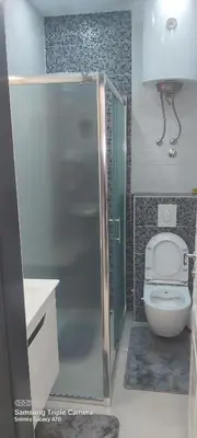 a small bathroom with a toilet and a shower at STUDIO APARTMAN SOl in Tuzla
