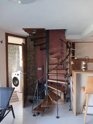a kitchen with a wine rack in a room at Una, Home on river bank in Spilja
