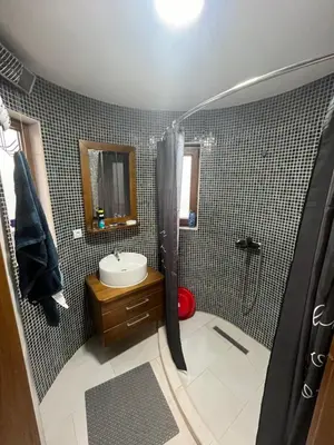 a bathroom with a shower and a sink at Una, Home on river bank in Spilja