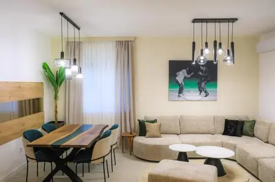 a living room with a couch and a table at Fancy new 2bdrm ap free garage in Banja Luka
