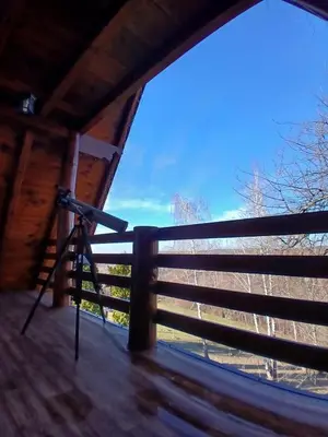 a camera on a fence with a view of the sky at Forest house ALEKSANDAR in Srbac
