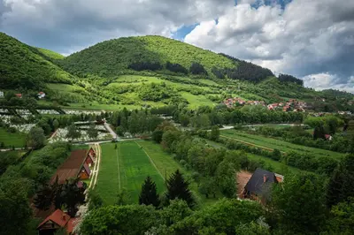 an aerial view of a village in the mountains at The Hide Aside in Plješevica