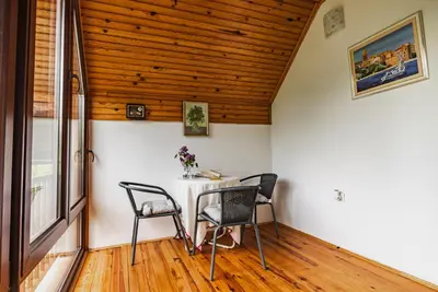 a dining room with a table and chairs at The Hide Aside in Plješevica