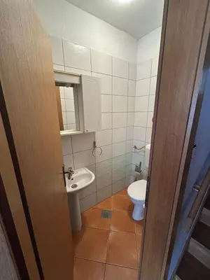 a bathroom with a toilet and a sink at Premium Apartment in Fojnica