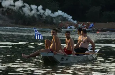 a group of people sitting in a boat in the water at Apartments Padrino BP in Bosanski Novi
