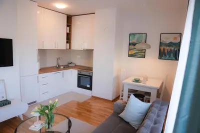a living room with a couch and a table at Apartman Mint&White Borik in Banja Luka