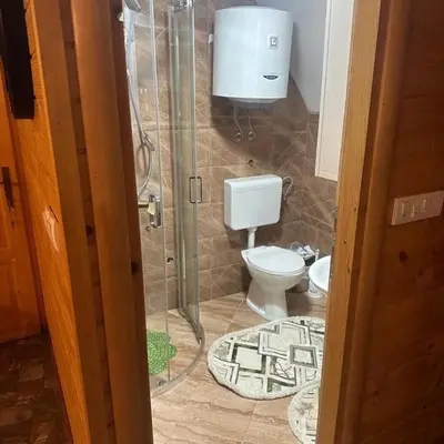 a bathroom with a shower and a toilet in it at Vikendica Elenda Banja Luka in Laktaši