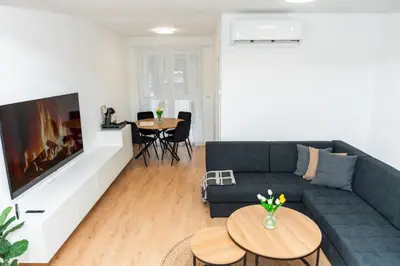 a living room with a couch and a table at Apartment Friday in Travnik