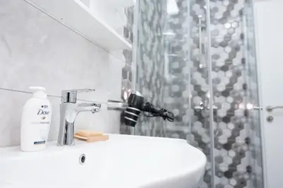 a bathroom with a sink and a shower at Apartment Friday in Travnik