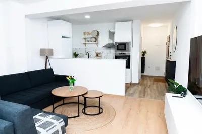 a living room with a couch and a table at Apartment Friday in Travnik
