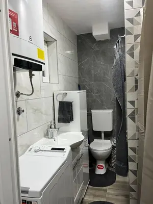 a small bathroom with a sink and a toilet at Apartman Ivana in Banja Luka