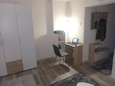 a room with a desk with a laptop and a chair at Apartman Ivana in Banja Luka
