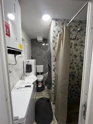 a bathroom with a sink and a toilet and a shower at Apartman Ivana in Banja Luka