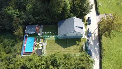 an overhead view of a house with a swimming pool at Vikendica VILLA A1 in Banja Luka