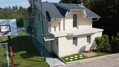 an overhead view of a house with a basketball hoop at Vikendica VILLA A1 in Banja Luka