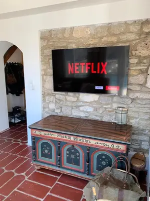 a tv on top of a stone wall with a television at Sokograd Royal in Šipovo