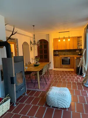 a kitchen with a table and a dining room at Sokograd Royal in Šipovo