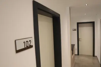 a hallway with two doors in a building at Rajske doline in Oćune