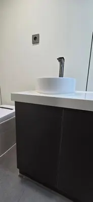 a bathroom counter with a sink on top of it at APPLE Cabin with Jacuzzi - Sauna in Drenova Glavica