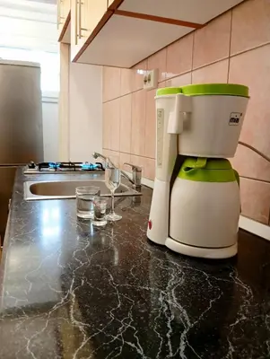 a coffee maker sitting on a counter in a kitchen at Apartman Doboj in Doboj