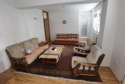 a living room with a couch and two chairs and a table at Apartman Urban Rest in Doboj