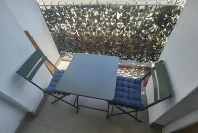 an overhead view of a table and a chair at Apartman Urban Rest in Doboj