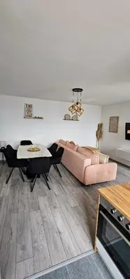 a living room with a couch and a table at Apartman Vrućica view in Teslić