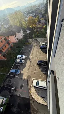 a group of cars parked in a parking lot at Apartman Vrućica view in Teslić