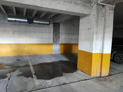 a parking garage with a car parked in it at Apartman Sedra in Bihać