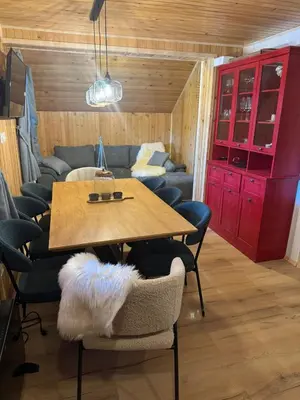 a dining room with a table and chairs at Mountain Mia in Šišava