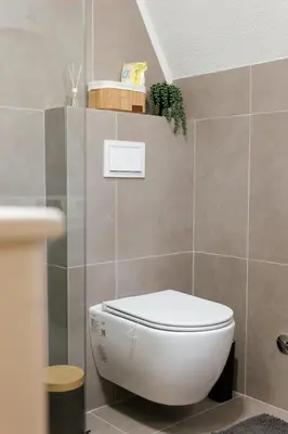 a bathroom with a white toilet in a room at Vikendica miRAJ Manjaca in Gornje Ratkovo
