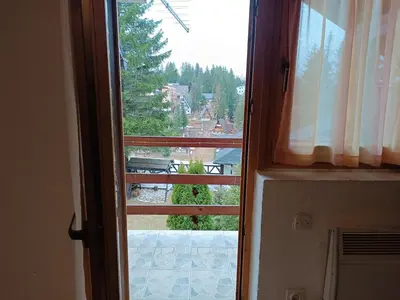an open door with a view of a balcony at Relaks dream in Vlasic