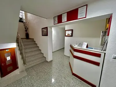 a hallway with a staircase in a building at Prenoćište Euro-Jet Ćoralići in Ćoralići