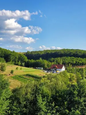 a house in the middle of a field at Apartman HADŽILUK in Bugojno