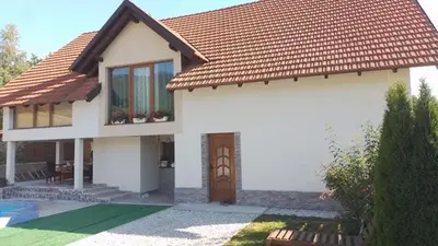 a rendering of a house with a red roof at Apartman HADŽILUK in Bugojno