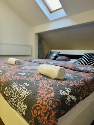 a bedroom with two beds with towels on them at Petra Luxury in Livno
