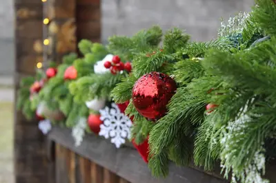a row of christmas trees on a wall at Cozy Wooden Cottage in Banja Luka