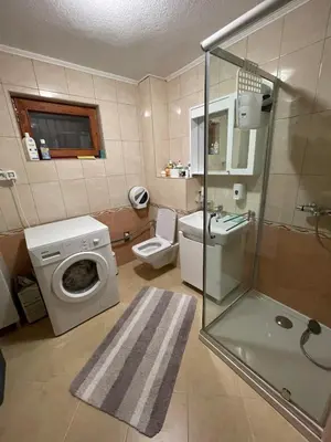 a bathroom with a toilet sink and a shower at Villa Gabi Vlašić in Travnik